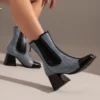 Ankle boots with back zip and thick heel in serpentine microfiber