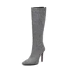 Knee-high serpentine high heel boots with back zip