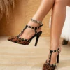 Leopard print slingback pumps with buckle strap and thin heels