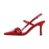 Red pointed toe ankle strap sandals in black patent leather